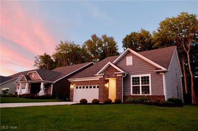 View of front of house with a yard and a garage | Image 1