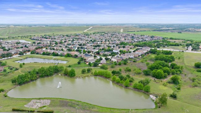 Aerial overview of property's location featuring a nearby body of water and nearby suburban area | Image 30