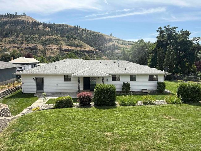Rear view of property with a mountain view and a patio area | Image 6