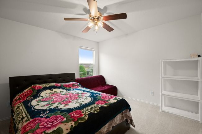 Bedroom with carpet and ceiling fan | Image 19