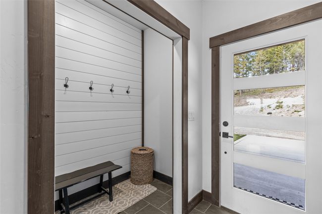 Mudroom featuring dark tile patterned flooring | Image 16
