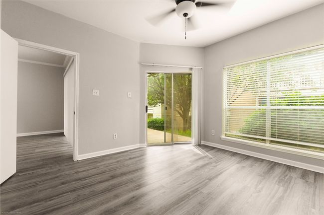 Primary bedroom has separate glass door access to covered patio. Lots of natural light! | Image 13