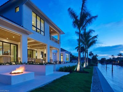 View of swimming pool featuring pool water feature | Image 2