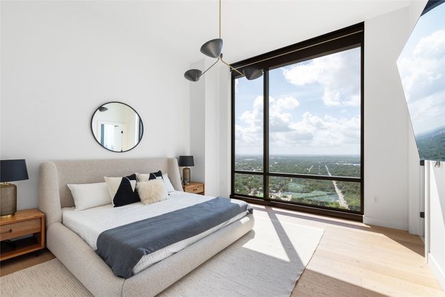 Bedroom with wood finished floors and baseboards | Image 18