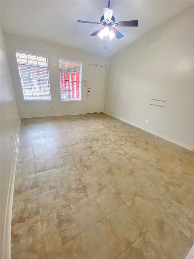 Spare room featuring ceiling fan and baseboards | Image 4