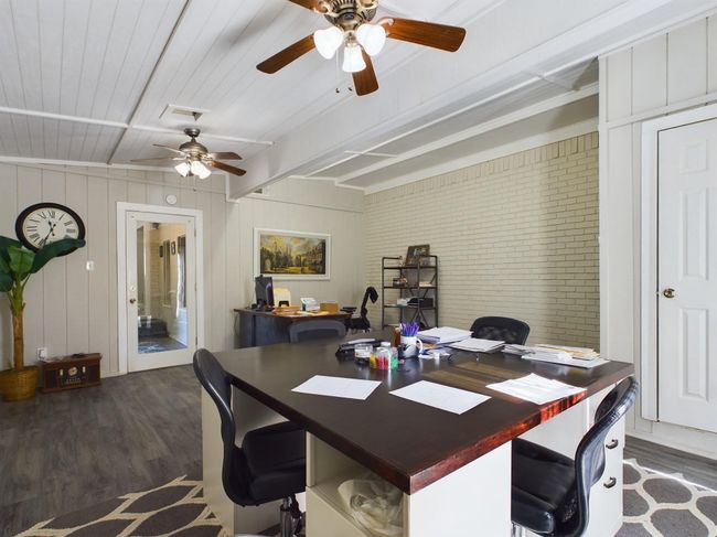 Office space featuring beam ceiling, dark wood-style floors, and ceiling fan | Image 17