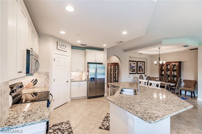 TILE ON THE DIAGONAL! GREAT OPEN KITCHEN TO DINING AREA MAKES THIS OPEN CONCEPT PERFECT TO ENTERTAIN! | Image 13