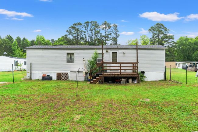 Back of property with a wooden deck | Image 24