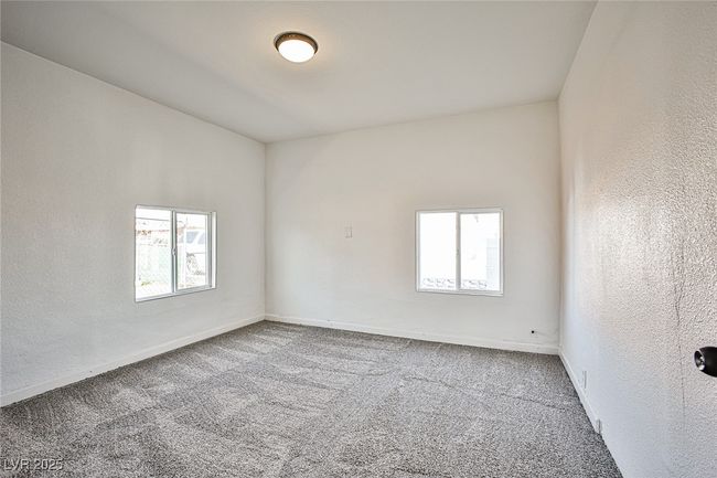Empty room featuring carpet flooring and a textured wall | Image 19