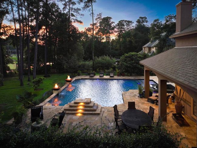 This backyard offers breathtaking sunset views over the lake every evening...the perfect spot to unwind with a glass of wine after a long day... | Image 4