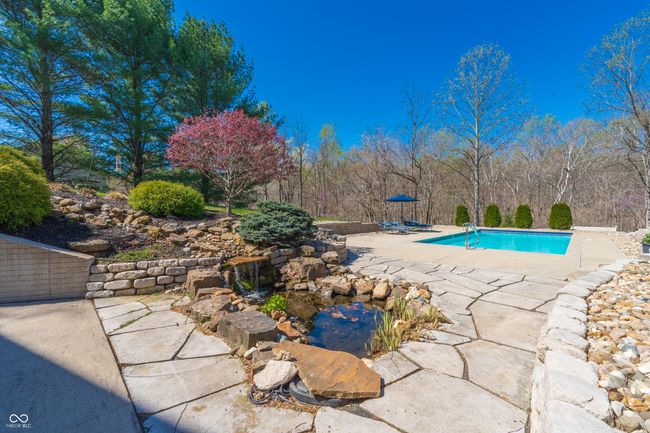 outdoor pool with a patio | Image 34