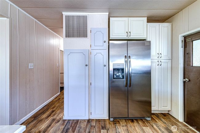 Stainless fridge and large pantry. | Image 18
