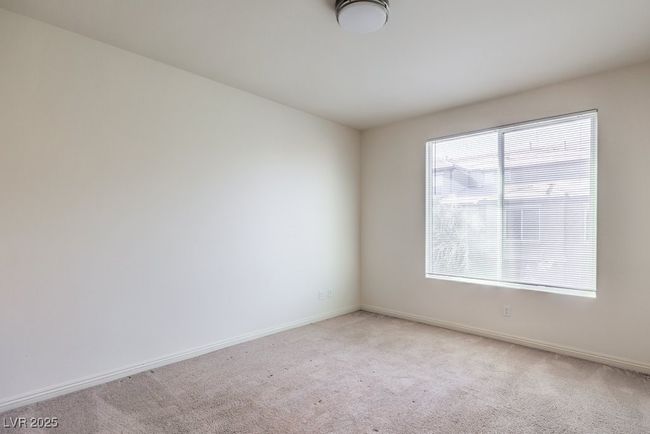 Spare room with baseboards and light colored carpet | Image 21