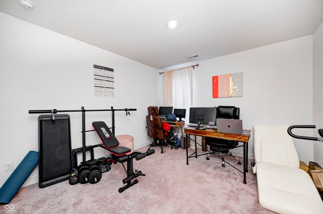 carpeted office featuring visible vents and baseboards | Image 21