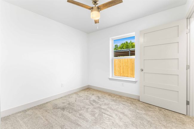 Empty room featuring carpet floors, ceiling fan, and baseboards | Image 25