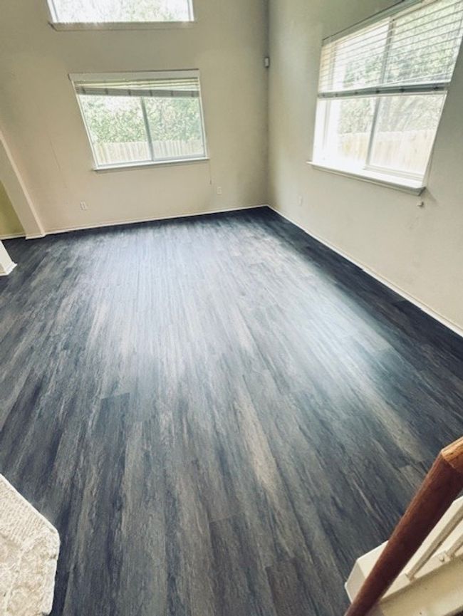 Spare room with dark wood-style flooring and healthy amount of natural light | Image 14