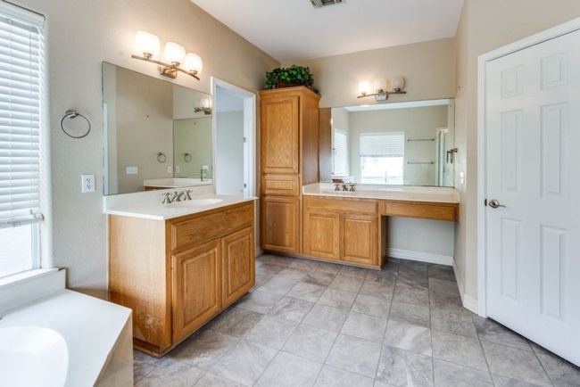 Bathroom with two vanities, a sink, and visible vents | Image 20