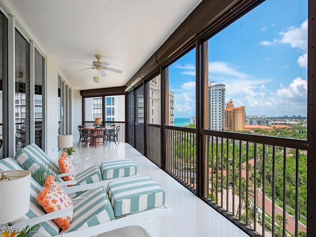 Screened Covered Balcony North/West views of beach and city. | Image 21