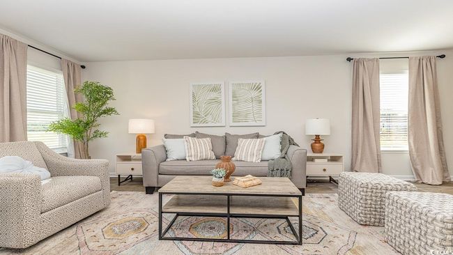 Living room with light hardwood / wood-style floors | Image 13