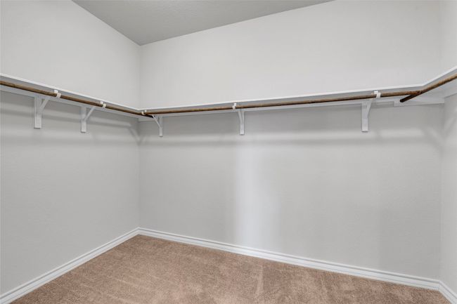 Walk in closet with carpet | Image 12