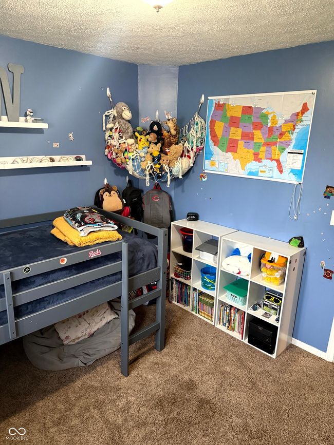 bedroom with a textured ceiling and carpet | Image 20