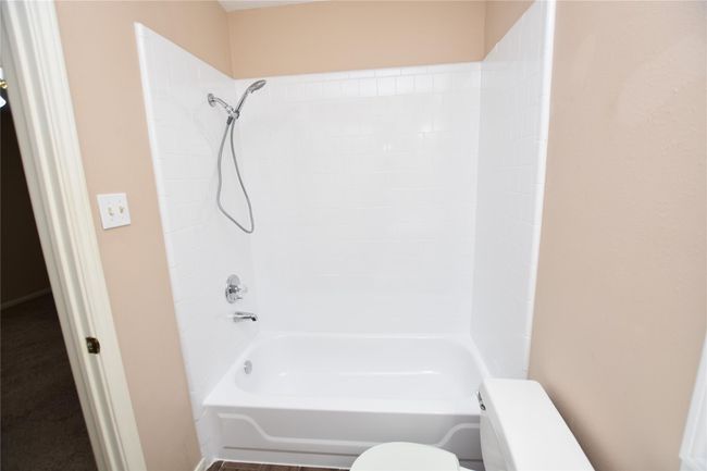 For both practicality and comfort, featuring a clean tub/shower combination that caters to diverse bathing preferences. | Image 18