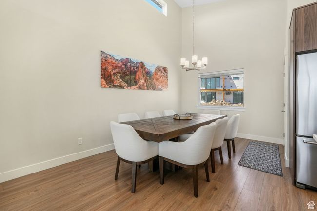 The dining area, positioned just off the open-concept kitchen with natural light, creating a warm and inviting atmosphere for both casual dining and entertaining. | Image 22