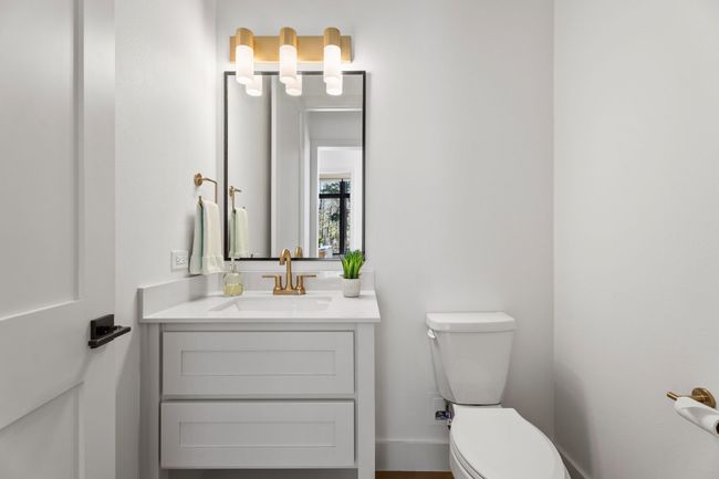 Bathroom featuring toilet and vanity | Image 28