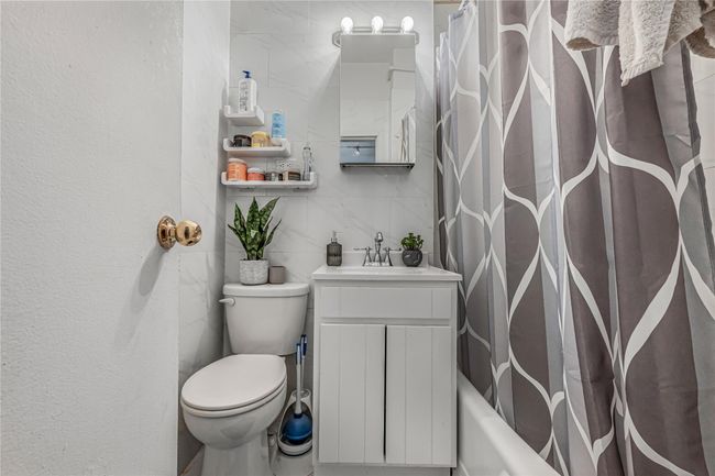 Bathroom with vanity and shower / bath combo with shower curtain | Image 9