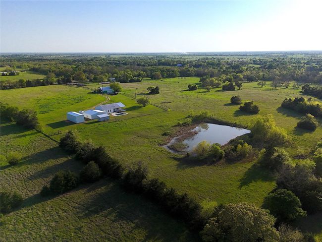 Aerial overview of property's location featuring rural landscape and a large body of water | Image 18
