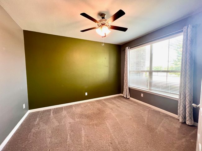 Spare room with carpet floors and ceiling fan | Image 9