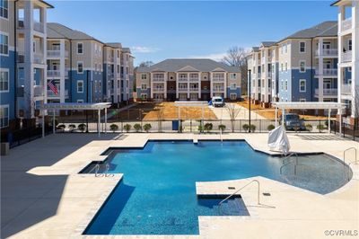 View of swimming pool with a patio area | Image 3