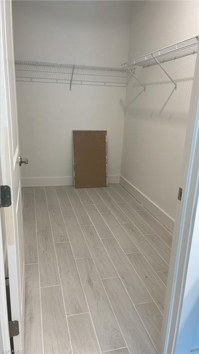 Primary bedroom walk-in closet | Image 19