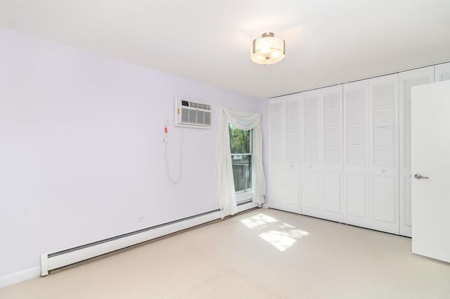 An entire wall of floor-to-ceiling closets provides plenty of storage space | Image 10