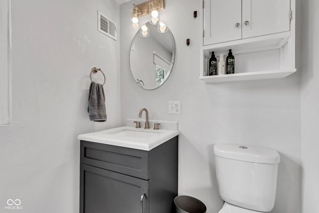 Upper floor second bathroom vanity and toilet. | Image 42