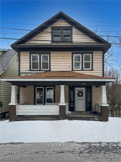 View of front of house with covered porch | Image 1