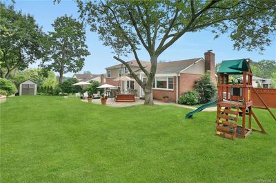 Professionally landscaped, with privacy fence, beautiful backyard space. Great for entertaining. | Image 2