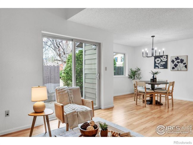 Open concept living with easy indoor-outdoor access through the sliding glass door to the back patio | Image 6