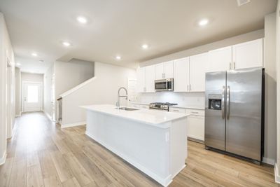 Large kitchen island with quartz top and gas stove! | Image 3