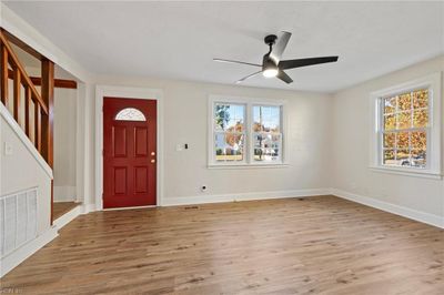 Sellers are proud to offer the new buyers the home with new lpv flooring throughout. The fan is new. The whole house has been painted and trimmed in a neutral pallet. This is the family room. | Image 3