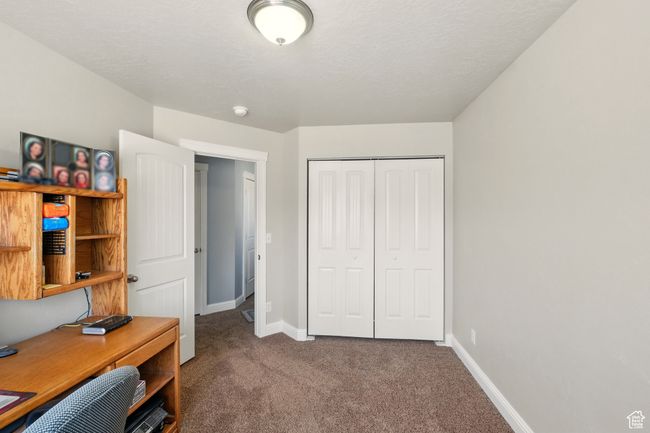 Carpeted office featuring baseboards | Image 23