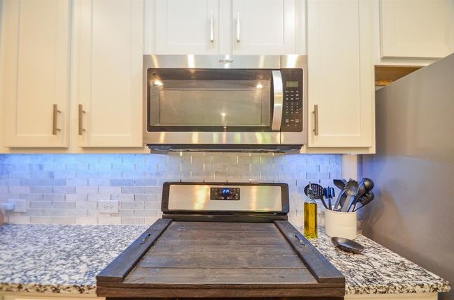 This is a gas cooktop that has a designer cover on it! | Image 10