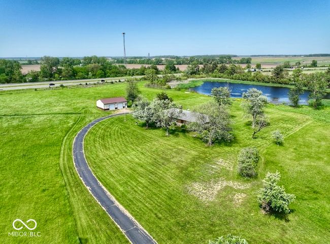 view of rural area with a nearby body of water | Image 8