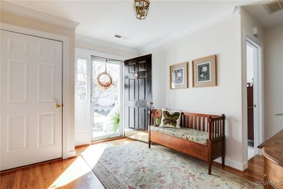 Light filled entrance with hardwood floors. | Image 3