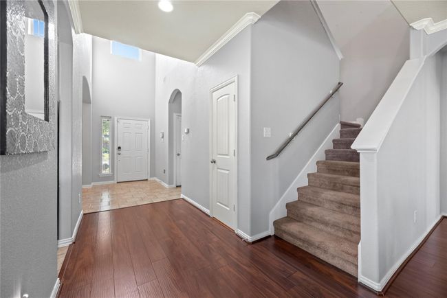 Upstairs, you’ll find a spacious game room, three inviting bedrooms, and two full bathrooms. | Image 24