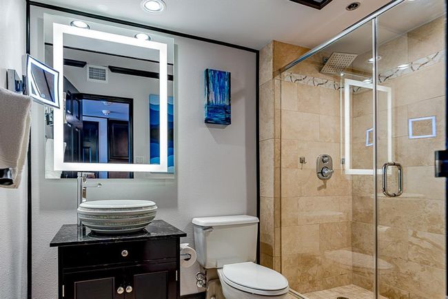 Beautiful bathroom with spa like features offers sleek fixtures, and calming neutral tones. | Image 12