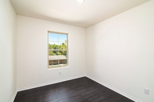 Bedroom featuring dark wood-type flooring | Image 12
