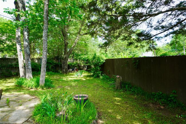 View of yard with a fenced backyard | Image 21