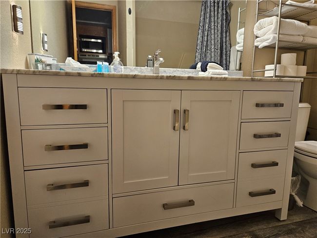 Bathroom featuring vanity and wood finished floors | Image 8