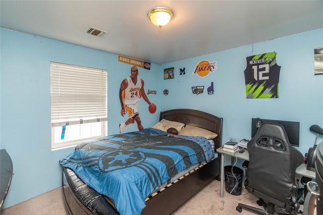 Bedroom with visible vents and carpet floors | Image 35